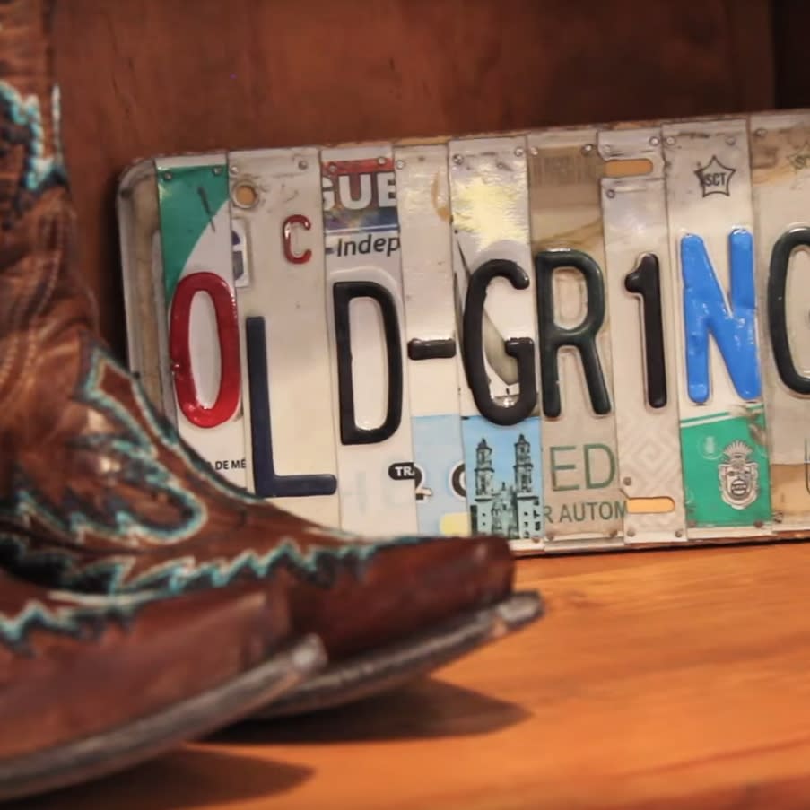 Cowboy boots and license plate at a store in Lakewood, Colorado