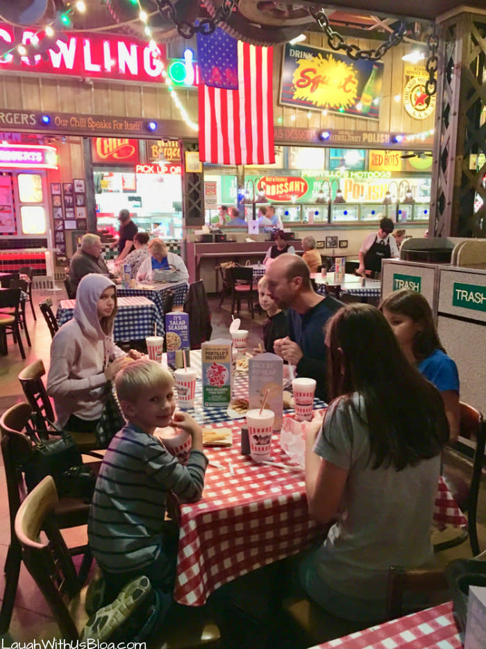 Family enjoying Portillo’s Hot dogs in Merrillville, IN
