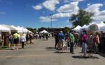 Crowds visit artisans at the Clothesline Festival in Rochester, NY