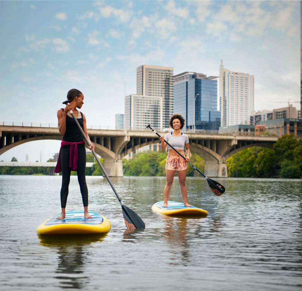 Stand up paddleboarding on Lady Bird Lake. Credit Visit Austin