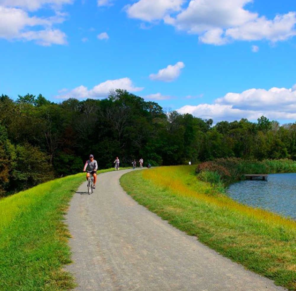 Some bikers riding along the Lawrence Hopewell Trail