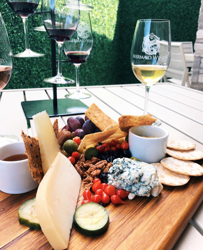 A platter of fresh fruit and cheese is paired with complementary wines at Mermaid Winery.