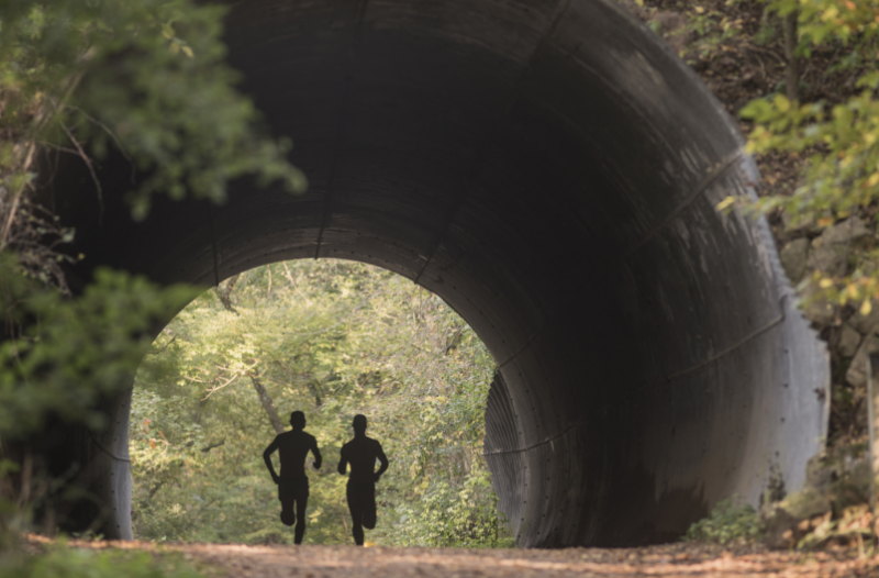 Two people running on the Putnam trail
