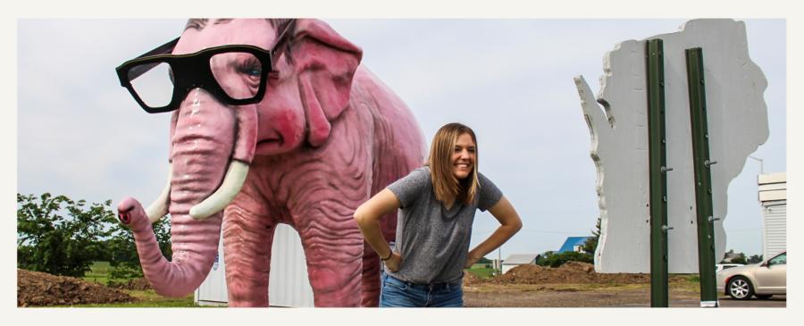 Woman posing in front of Pinkie the Elephant in DeForest, Wisconsin