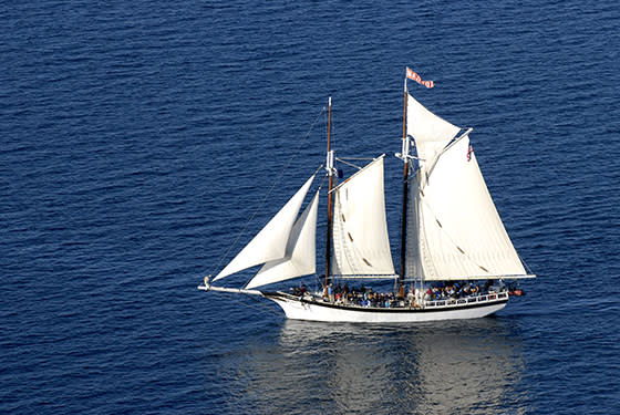 Tall Ship Manitou sailing in West Grand Traverse Bay on a sunny day