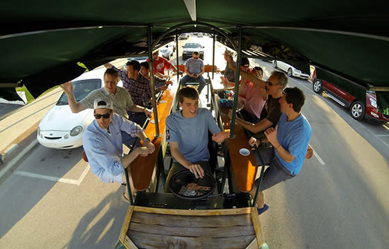 A group pedals around Downtown Traverse City on the TC Cycle Pub.