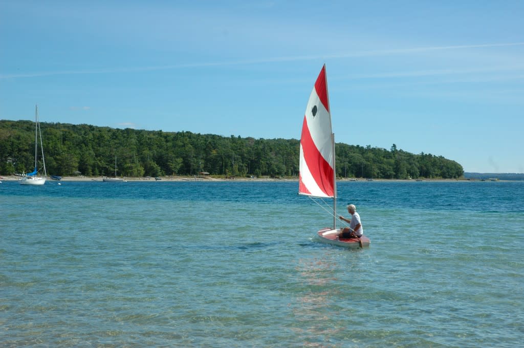 A Sunfish sailor in Old Mission Harbor.
