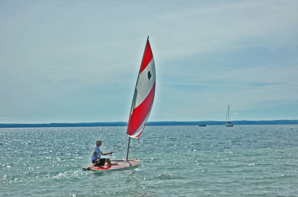 Gliding over the glitter in East Grand Traverse Bay.