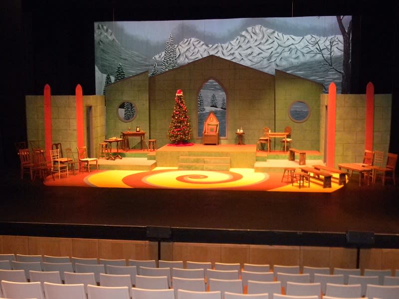 Arts United Center stage set up for a Christmas play The Arts United Center has traditional stage curtains and a spacious seating area.