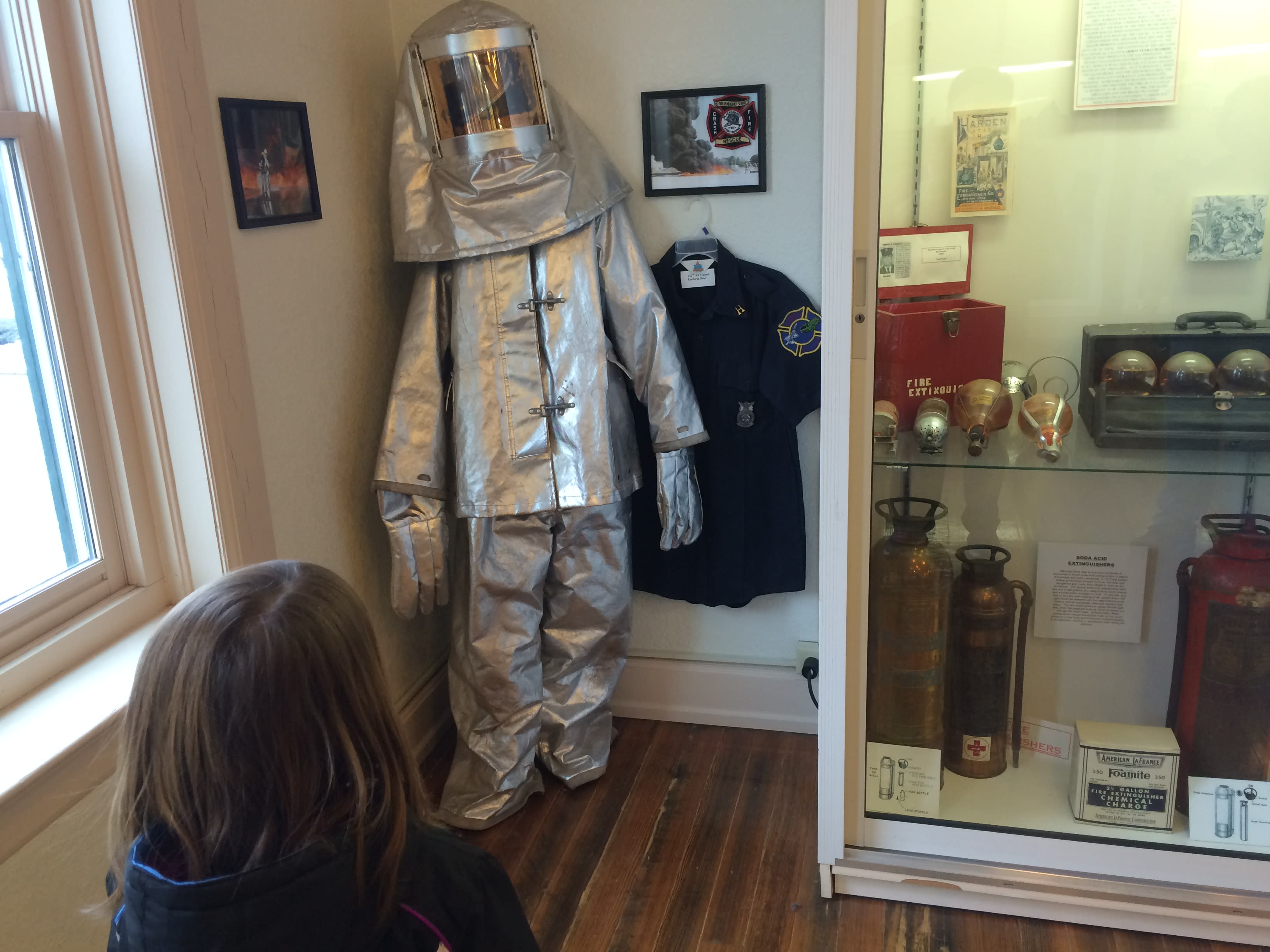 Protective fire suit for fires on airplanes