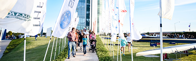 Image of family walking out of Championship Tower at the Oklahoma City Boathouse District during it