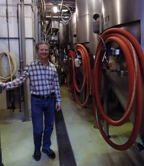 Chuck Magerl stands in his brewery on Mass St. in Lawrence, Kansas.