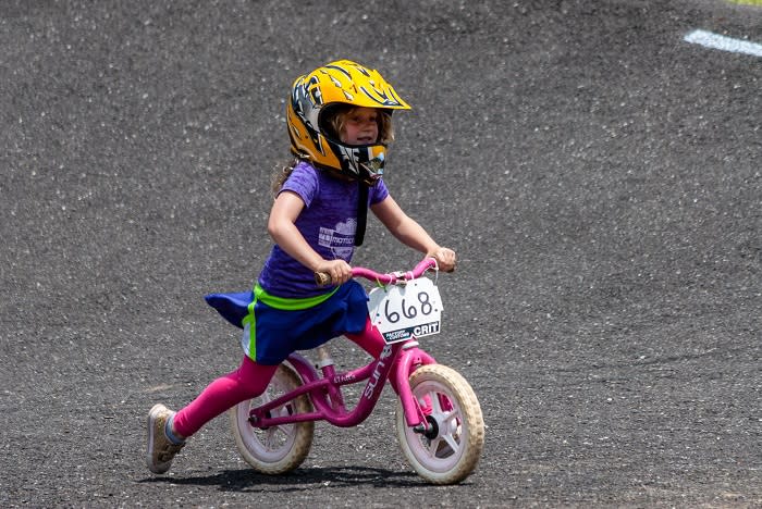 young girl learns to bike