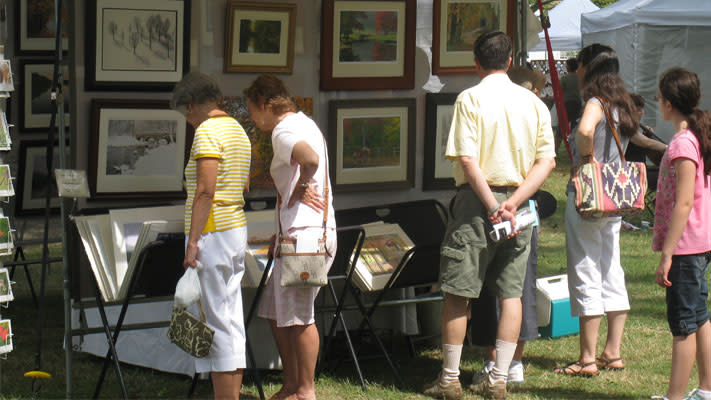Art lovers browse the juried works at the Lansdale Festival of the Arts