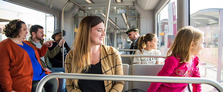 Passengers relax and enjoy the sites during their ride on the OKC Streetcar.