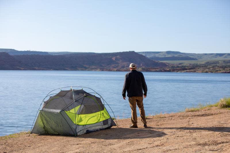 A camper enjoys the view from his Alcova campsite.