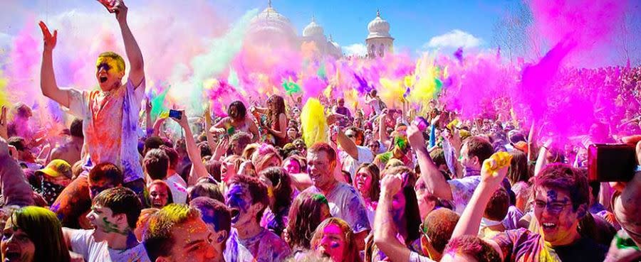 Guy on shoulders at Holi Festival of Colors