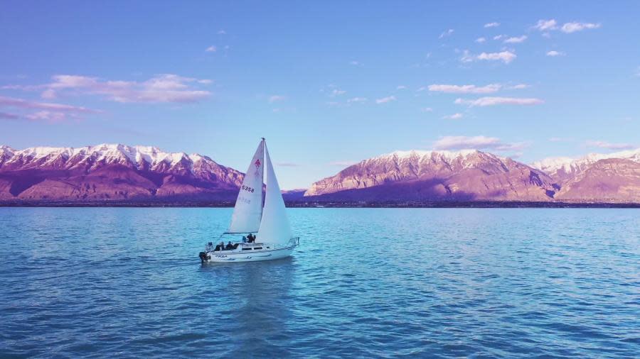 Sailing Boat on Utah Lake with Mountains in Background