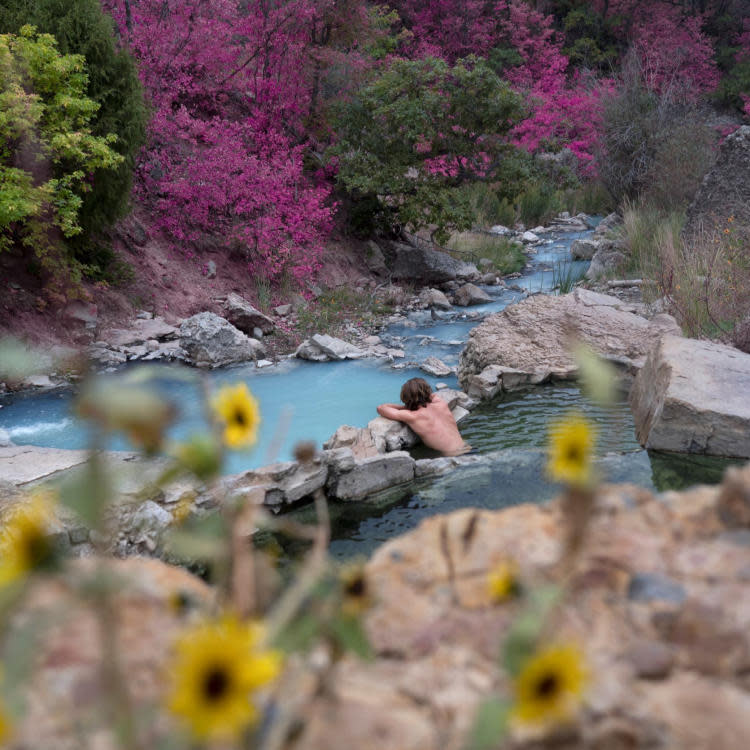 Man soaking in a hot spring