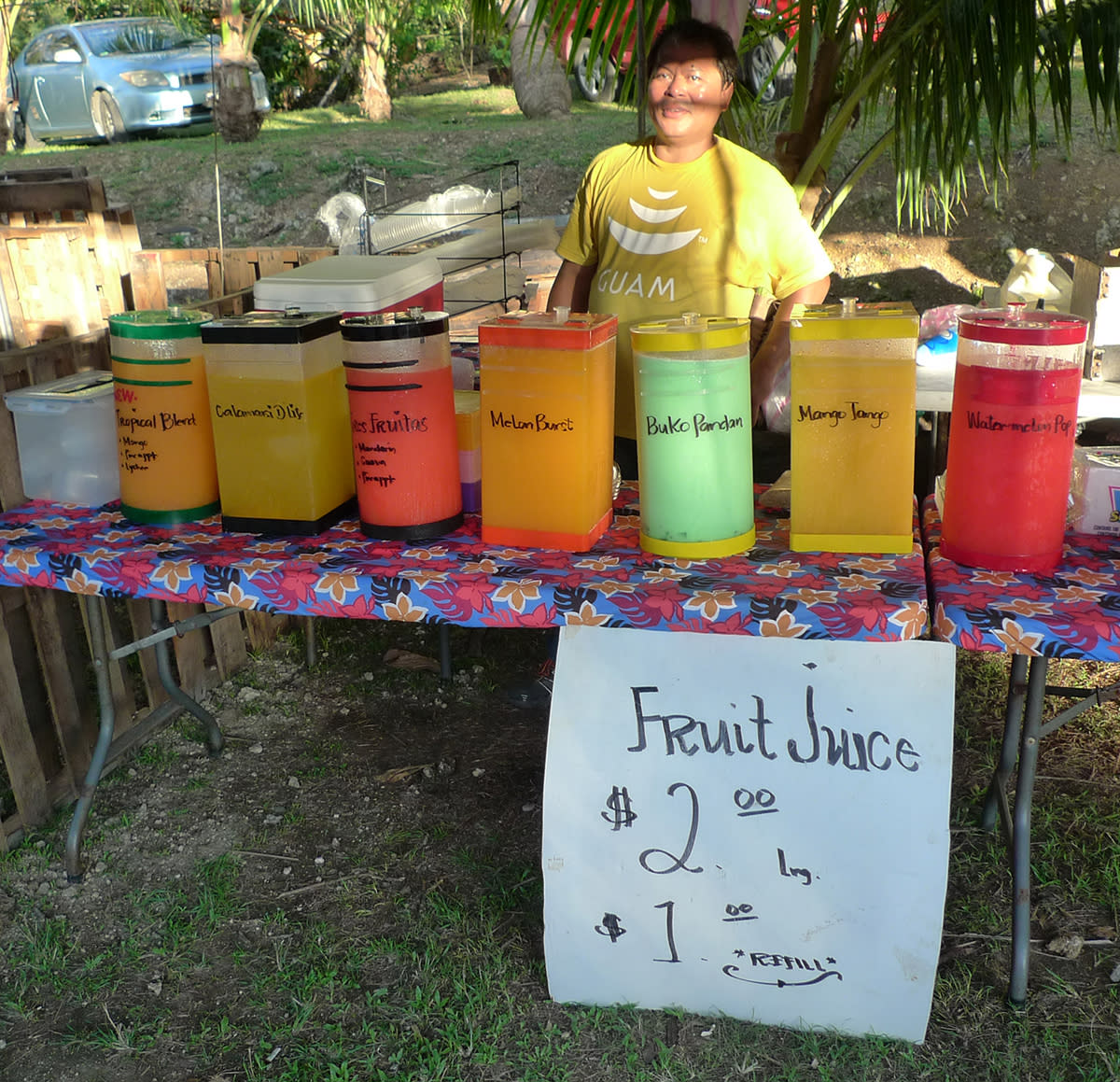 A vendor sells drinks made with local fruit