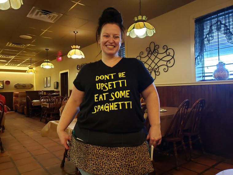 Waitress with "don't be upsetti eat some spaghetti" tee-shirt
