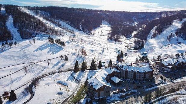 An overhead view of the ski slopes and buildings at Holiday Valley Ski Area.