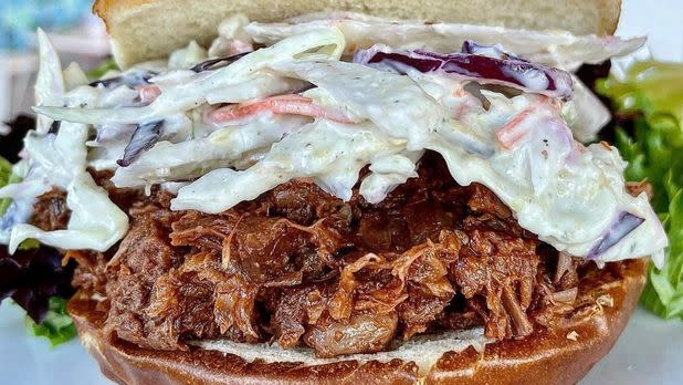 Pulled jackfruit sandwich topped with cole slaw