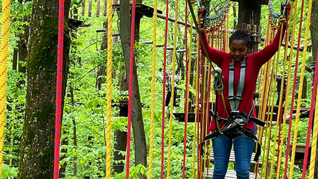 Young person on a ropes course