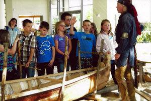 A group of people on a boat

Description automatically generated