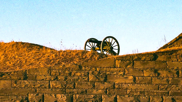 A view of a cannon on top of a wall at fort ontario