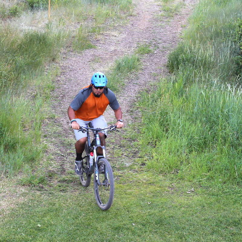 Mountain biker navigates a bike trail in Park City