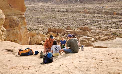 People Sitting In Chaco Culture National Historical Park Northwestern NM Pueblo Bonito Overlook