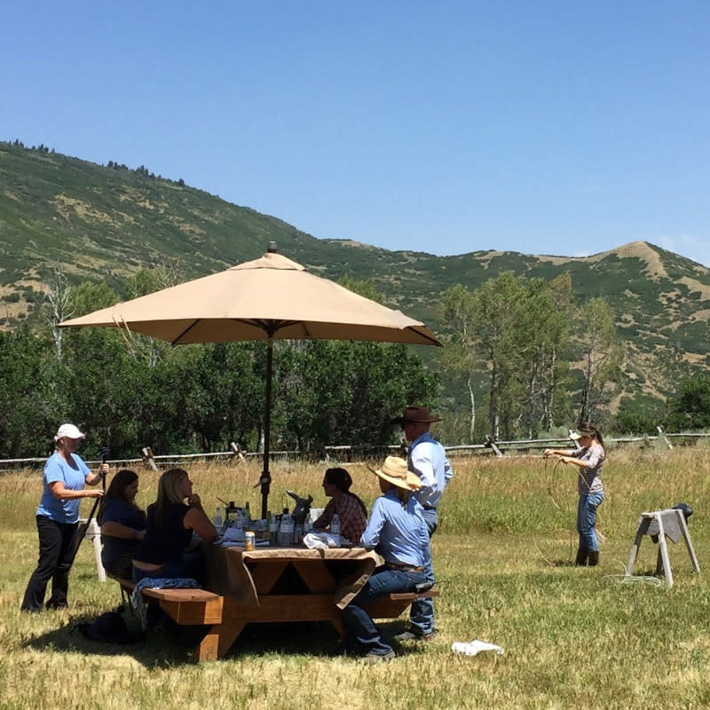 A group prepares for a horseback ride in the hills of Park City