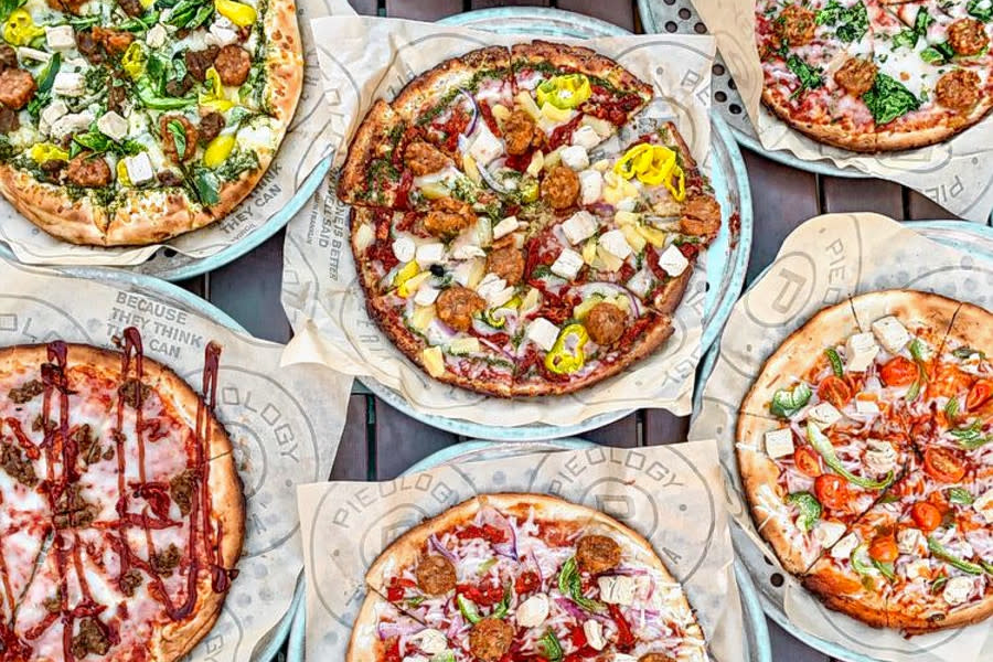 6 Different Pizzas On A Table