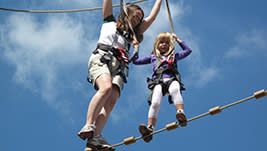 Parents can help kids or adults can help adults as you pass across ropes and through fun balancing feats. Totally exciting - totally safe. check it out!