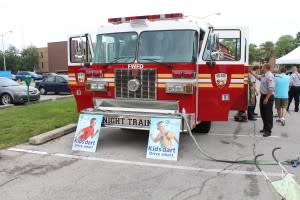The fire truck is big and shiny - perfect for exploring!