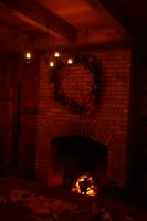 What could feel more like Christmas than a warm fire, a pine wreath and candles?