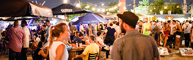 Image of people at Bleu Garten, an outdoor patio bar in the Midtown District of Oklahoma City.
