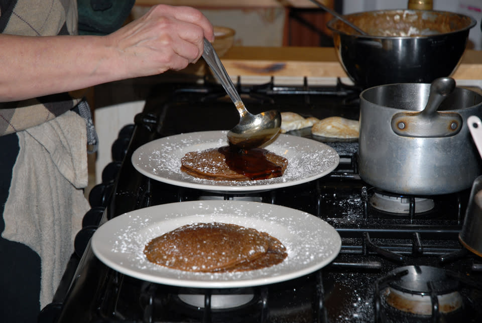 Chef Debbie Meritsky Ladling Syrup Over Beer Batter Pancakes