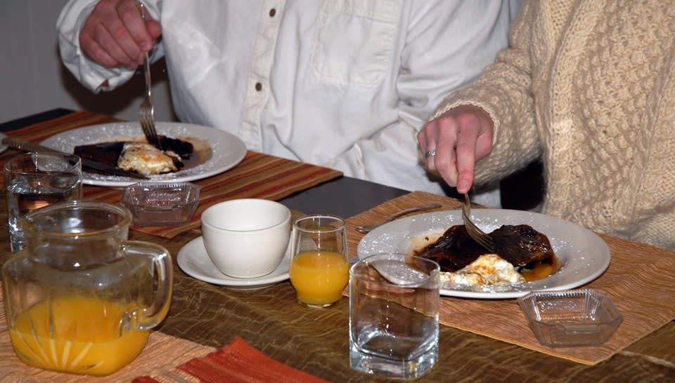 Couple Enjoying Beer Batter Pancakes with Ganache