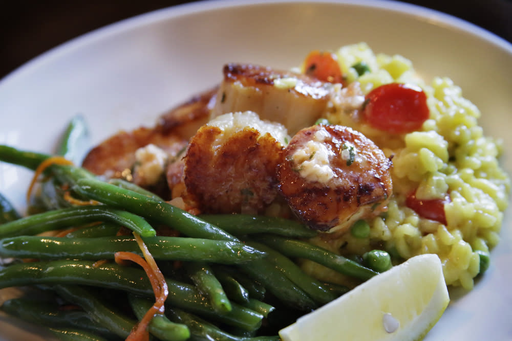 The Seared Scallops with tomato butter and saffron green pea risotto at the Charlestown Rathskeller  Jill Connor / The Westerly Sun