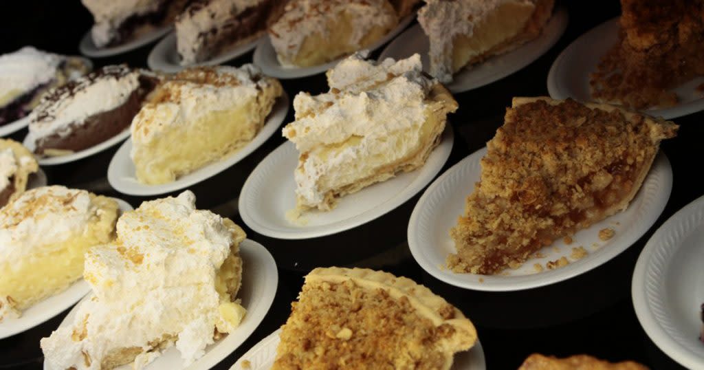 Rows of small paper plates with assorted slices of pie from Baker's Nook in Elkhart, Indiana