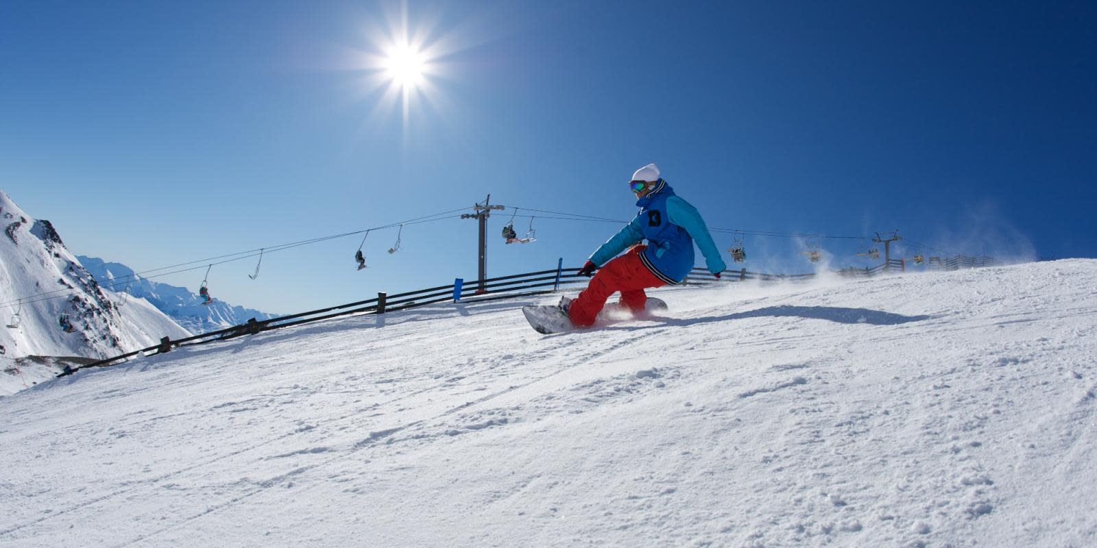 Snowboarder riding at The Remarkables ski field