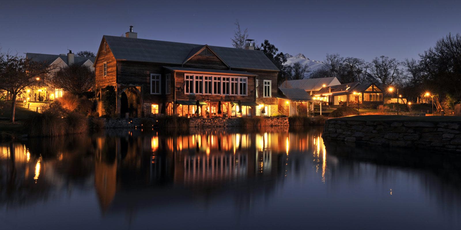 The Millhouse Restaurant at Millbrook lit up at night