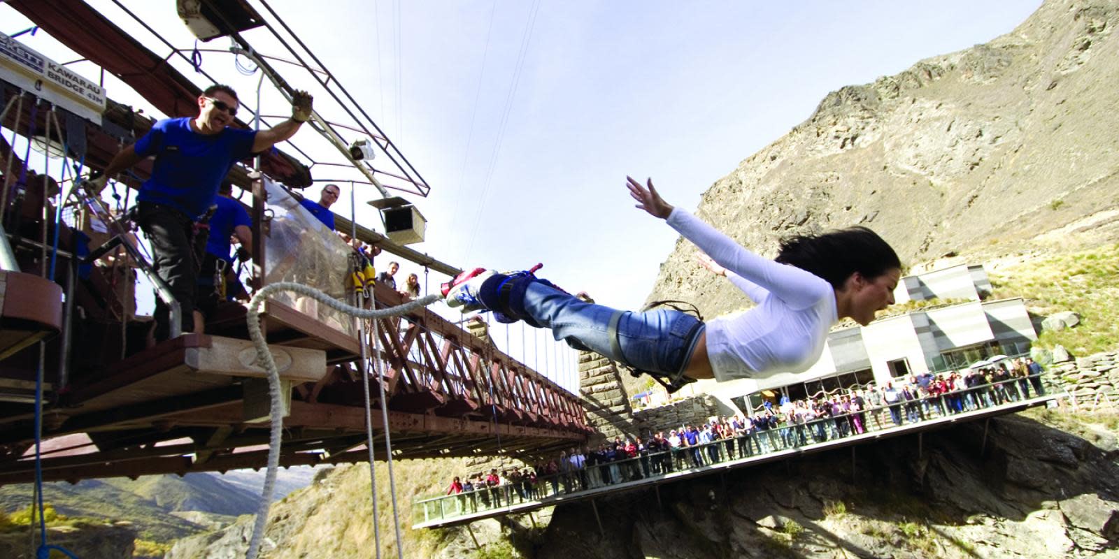 Woman jumping off the AJ Hackett Kawarau Bungy Bridge