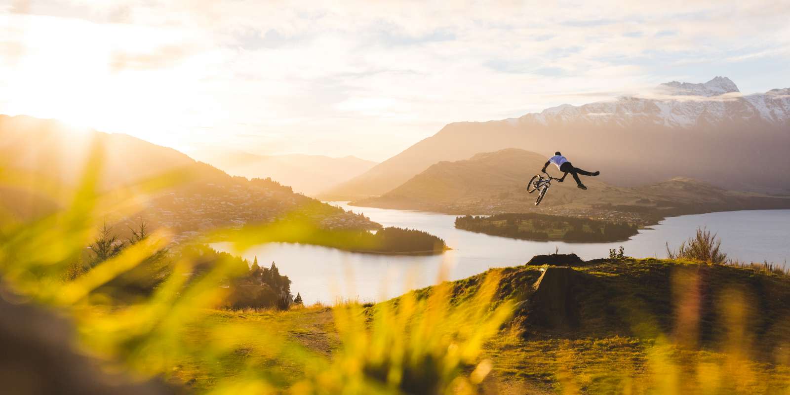 Mountain Biker Jumping in Queenstown New-Zealand