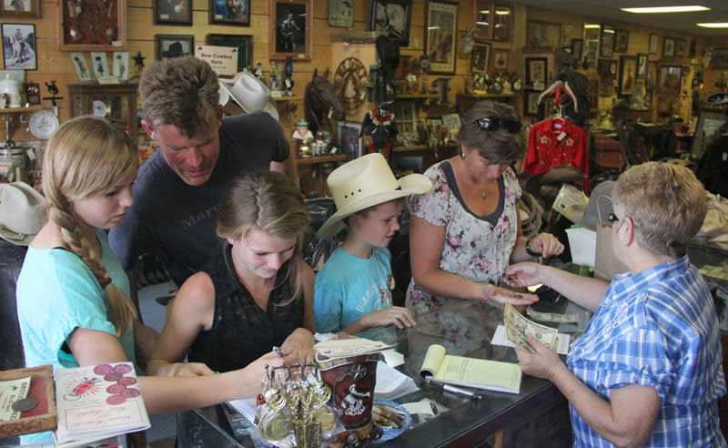 A family from western Europe views western style items. 