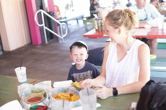 Mother and son eating at Lucy Buffet's Lulu's