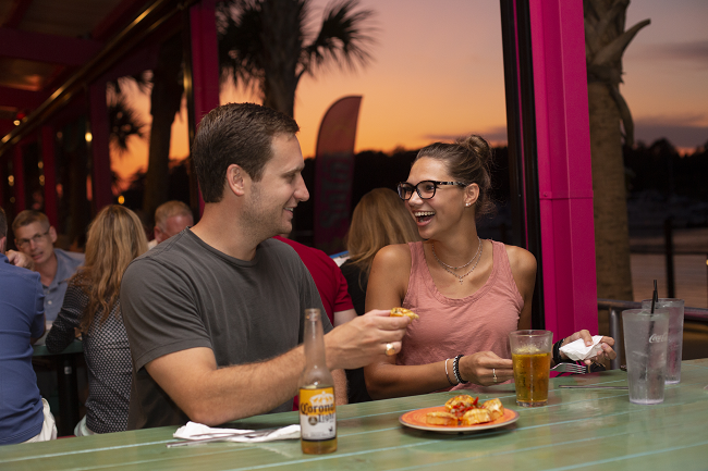 Couple eating at Lucy Buffet's Lulu's In North Myrtle Beach, SC