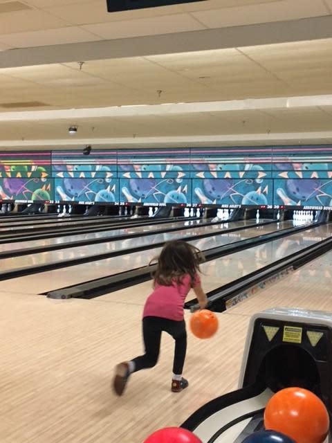 After dinner I would have been content to go back and relax at the hotel.  However, these kids had energy to burn....clearly we didn't work them hard enough doing yard work. There was lots of gutter balls, a few spares and a strike or two. Scores were low but spirits were high...young ones helped the big ones and bigs helped littles.